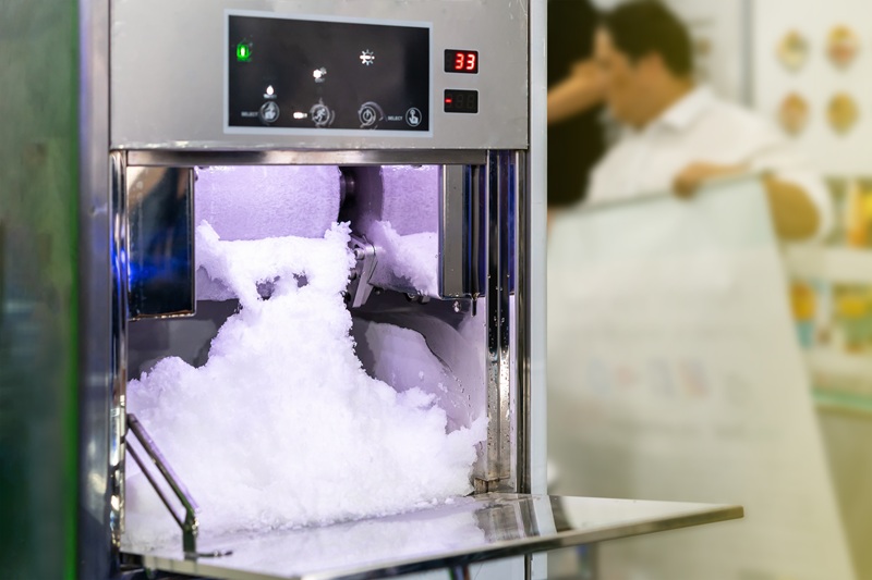 a person operating an ice machine